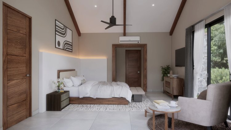 A modern bedroom with a white bed, wooden headboard, black and white abstract wall art, a small black nightstand with flowers, a beige armchair with a round coffee table, large windows with curtains, a patterned area rug, and a wooden wardrobe.
