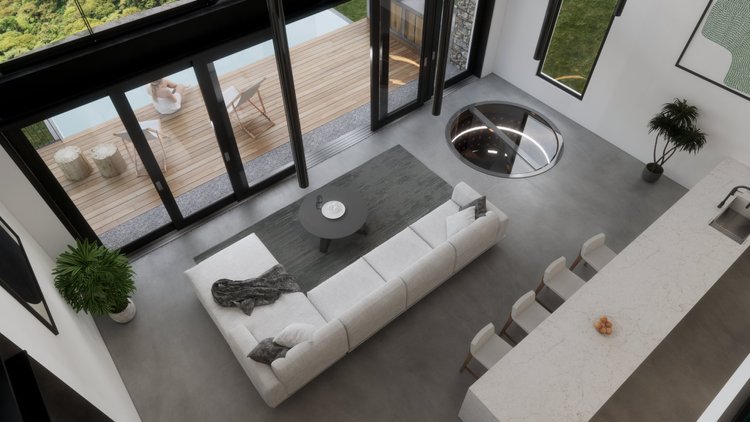 Modern living room with a white sectional sofa, gray rug, black coffee table, and large sliding glass doors leading to a balcony with outdoor chairs and a woman sitting outside, overlooking greenery.