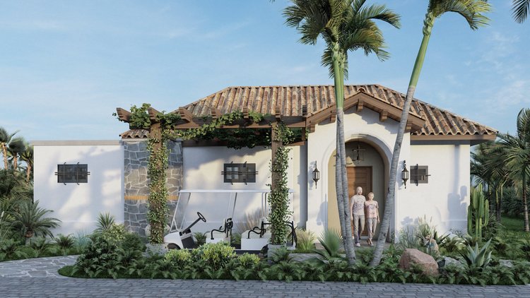 A house with a Spanish-style tiled roof, white walls, and decorative stone accents. There are two people walking out of the house, lush greenery including palm trees, cactus, and other plants around the house, and a paved driveway in the foreground.