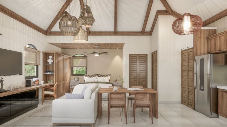 Open-concept living space with a bedroom, dining area, and kitchen, featuring wooden furniture, neutral decor, a TV, and pendant lighting.