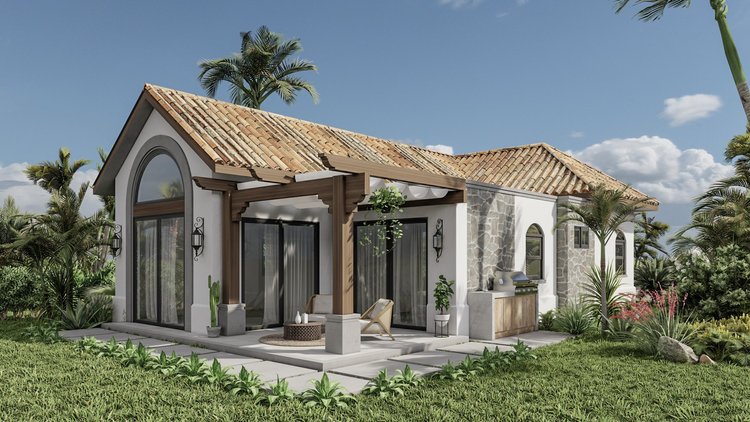 Modern single-story house with white stucco walls, stone accents, and a terracotta tile roof, surrounded by lush green plants and palm trees, with a small patio area featuring outdoor furniture.