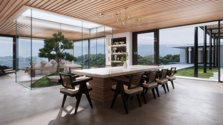 Modern dining room with a large white marble table, surrounded by nine black and white chairs, large windows showing mountains and greenery, a decorative tree, and minimalist shelving with vases and sculptures.