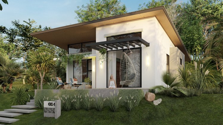 Modern house with large glass sliding doors and an outdoor hanging swing chair, surrounded by lush greenery and tropical plants.